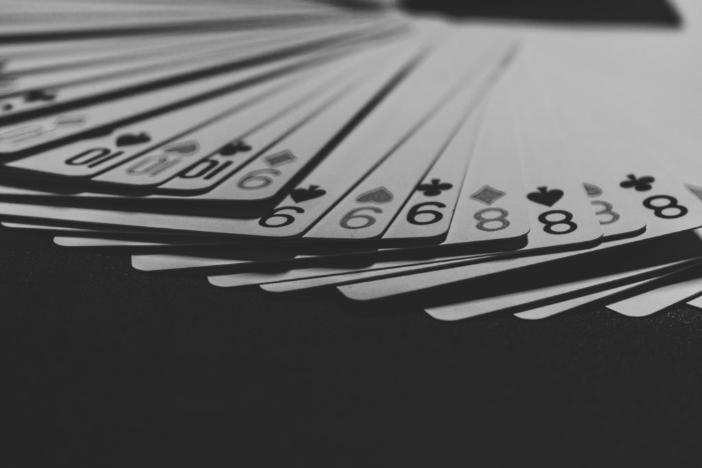 Black and white Casino Cards in a stack spread out