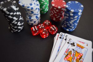 Playing cards with dice and casino chips for casino games